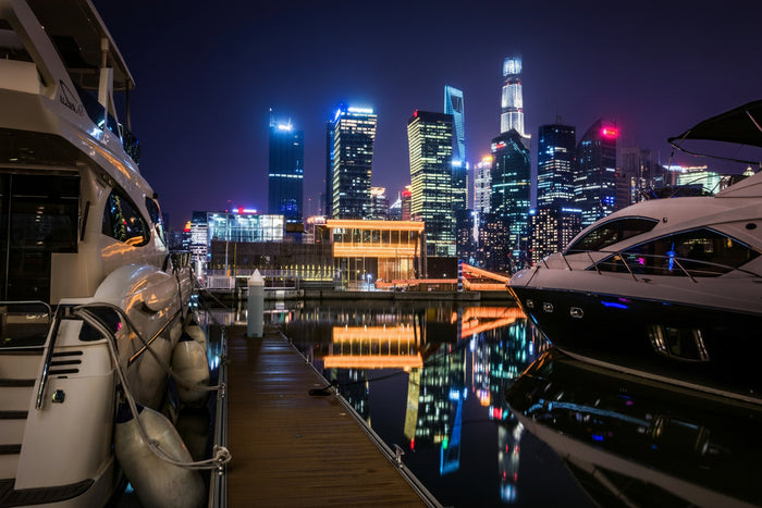 Promotional image for Alexandra Dhow Cruise with dinner and live entertainment, featuring a docked yacht with the text 'Dubai Marina'.